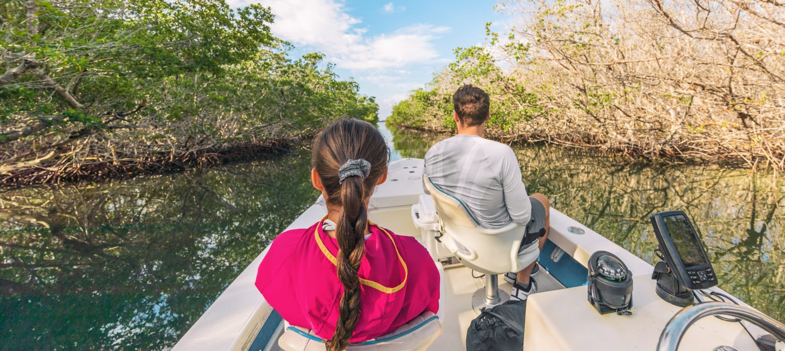 Popular tourist attraction from the Keys, Miami ,Orlando. People on guided ride for wildife sighthing of alligators, wetlands.