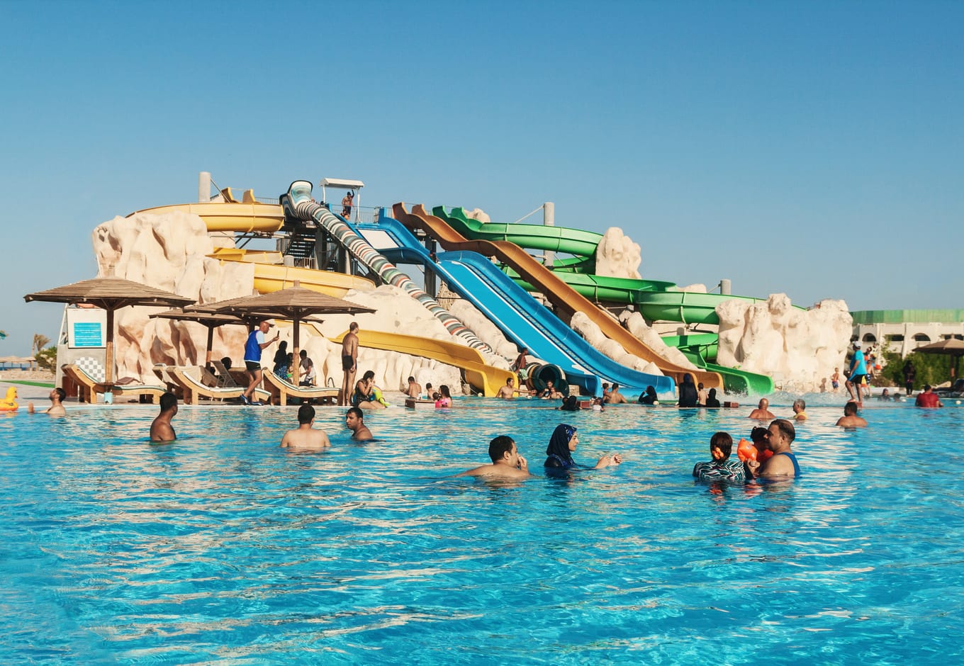 Colorful waterslides leading to a pool at the Wild Wadi Water Park, in Dubai. 