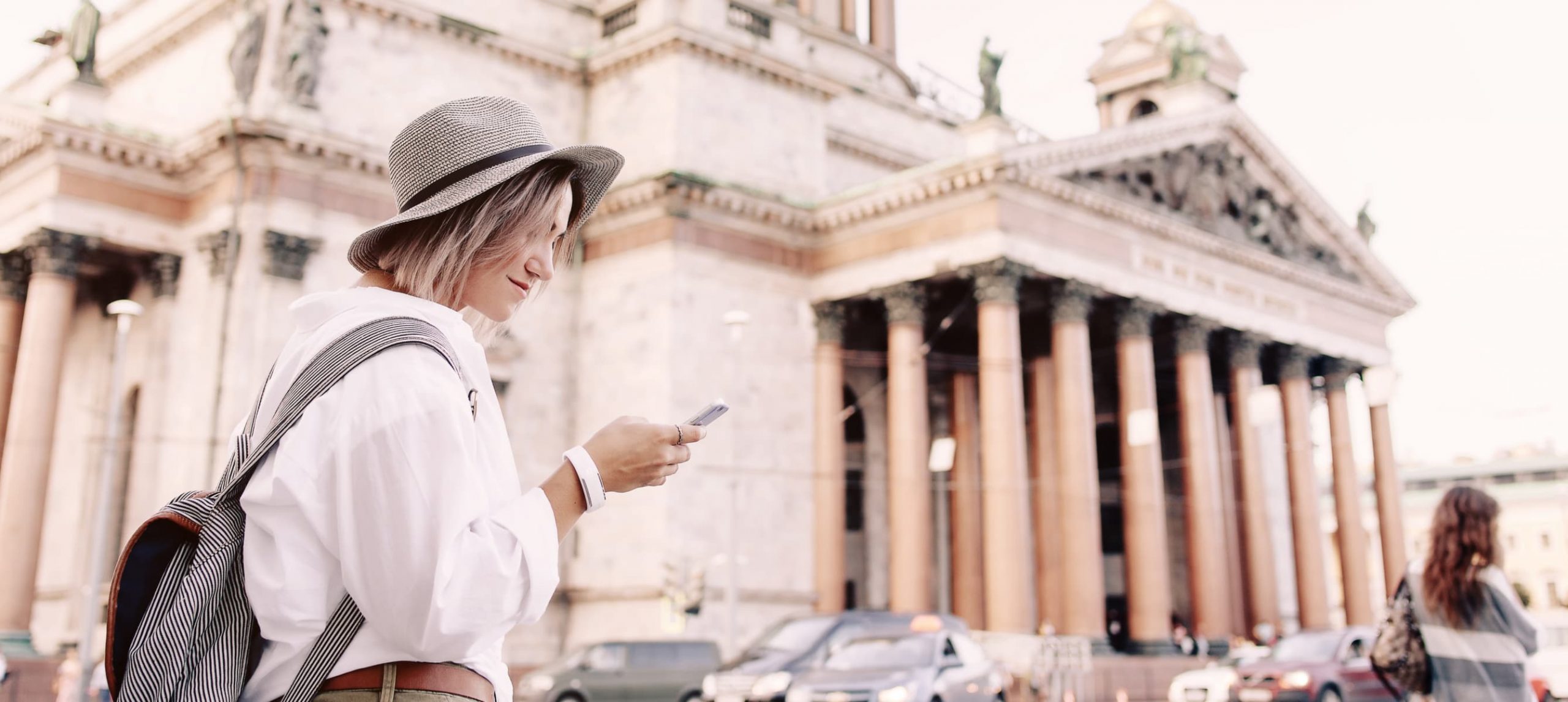 Tourist using navigation app on the mobile phone.