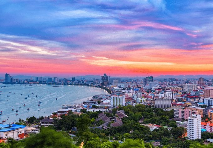 The building and skyscrapers at twilight time in Pattaya, Thailand. Pattaya city is famous for sea sports and nightlife entertainment.