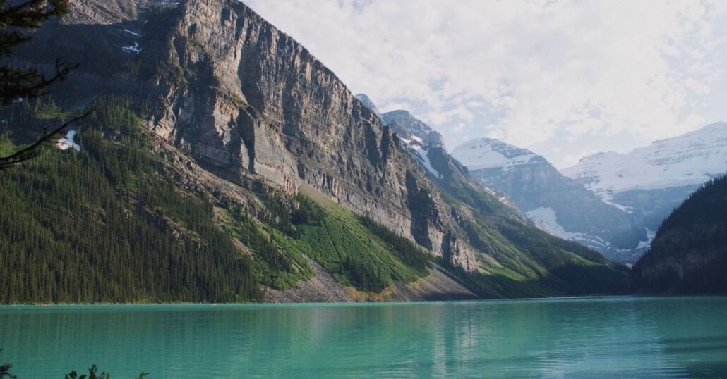 The turquoise waters of Lake Louise framed by a mountainous range at the Banff National Park, in Canada. 