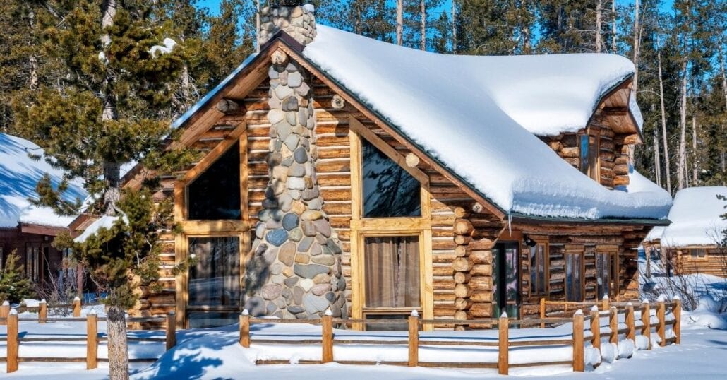 A wooden cabin covered in snow in Idaho.