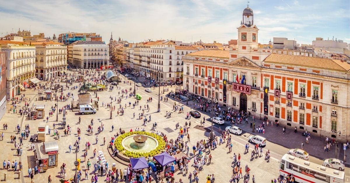 Puerta del Sol square filled with people.