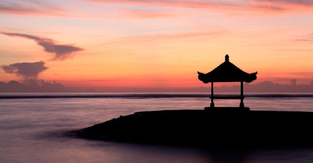 Pink and orange sunset on the Sanur Beach, in Bali.