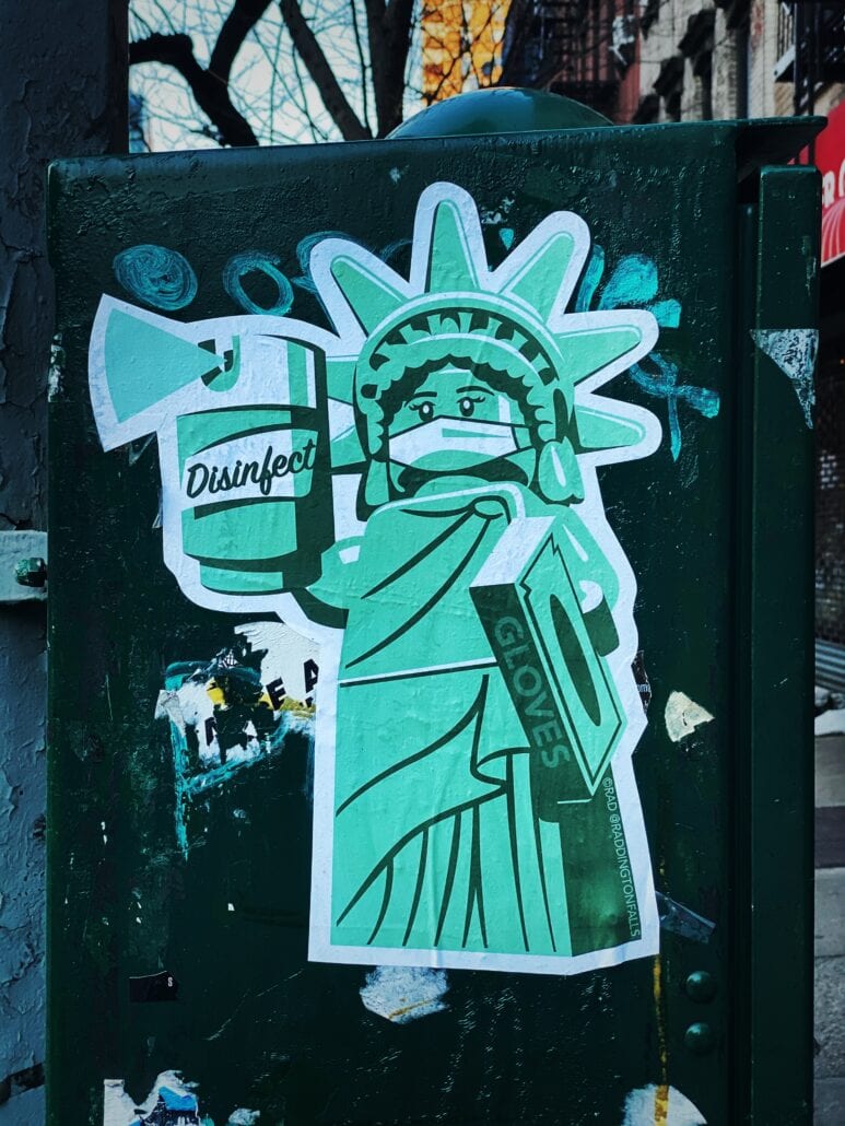 Wall art in New York City illustrating COVID precautions