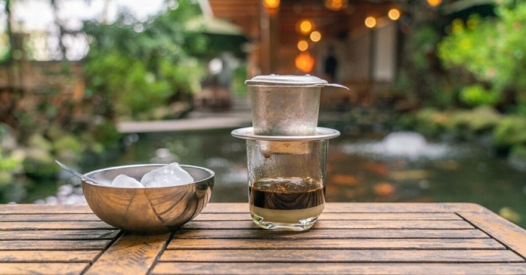 A cup of Vietnamese coffee is made using a Vietnamese Phin.