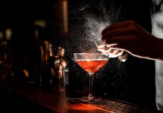 A drink being made by a bartender.
