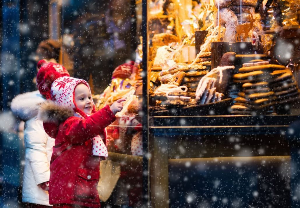 A child pointing at cookies at the cookie shop