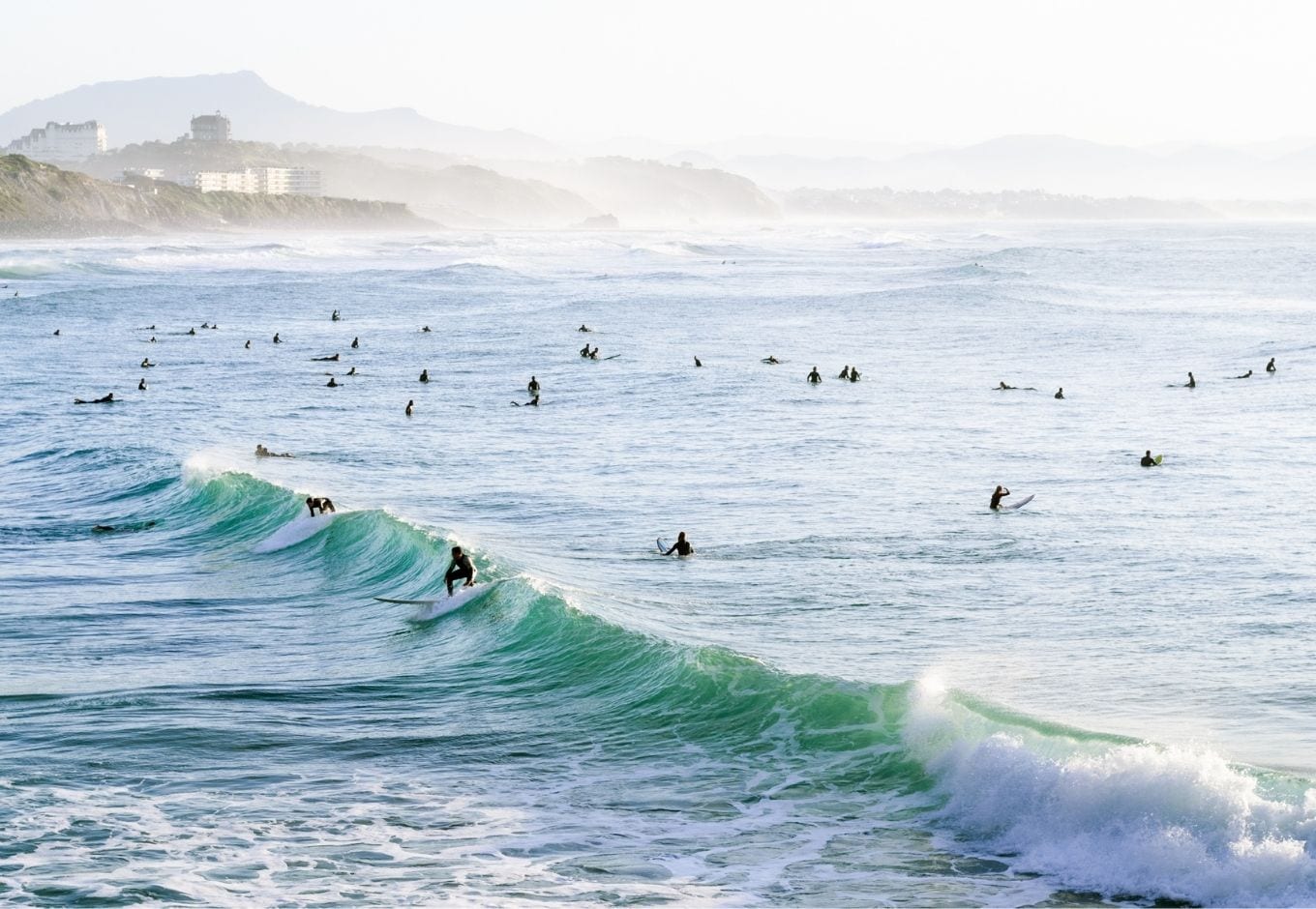 People surfing in Biarritz, France.