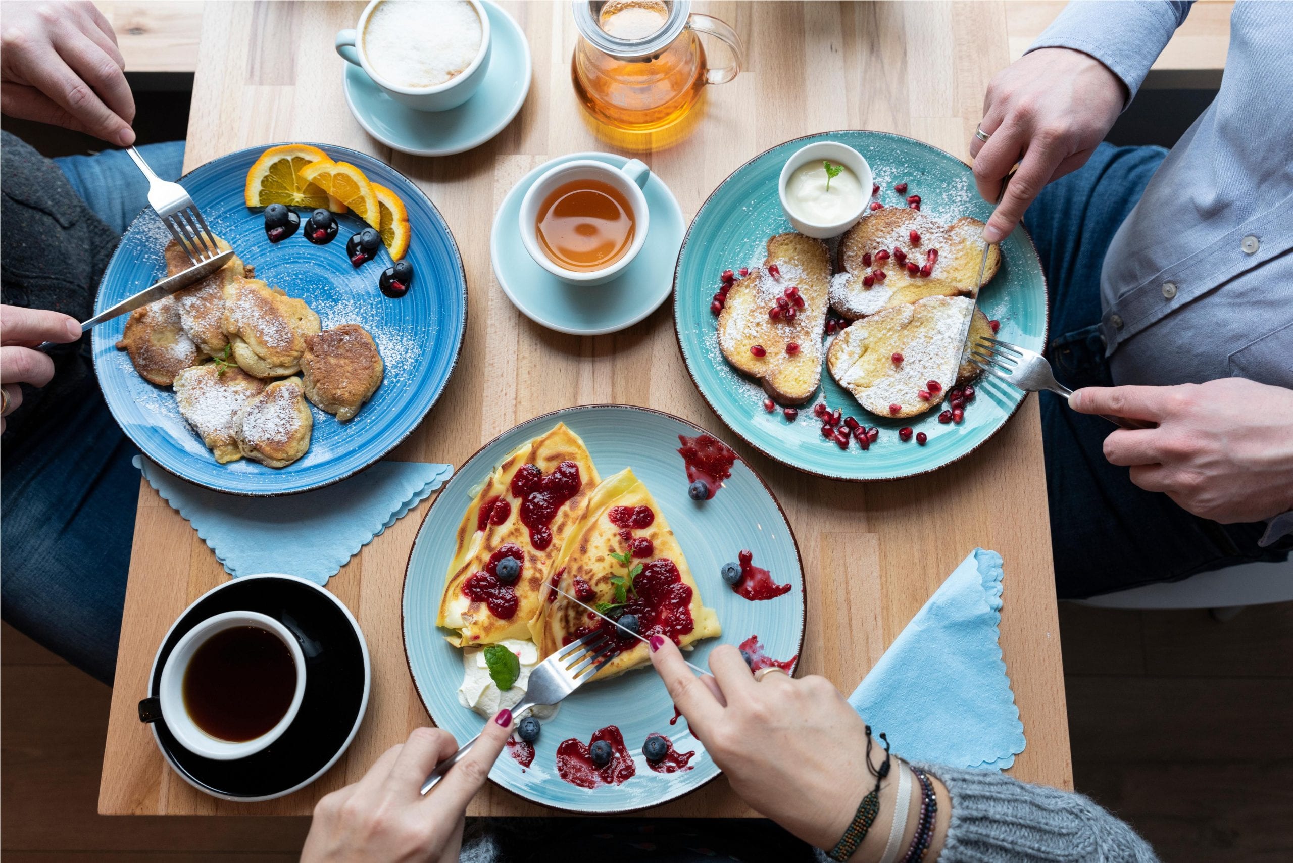 Different breakfast meal plates over a table.