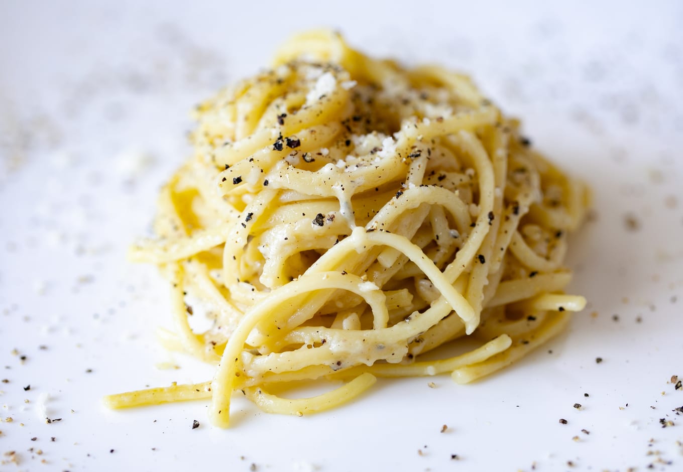 Cacio and pepe pasta toped with black peper.