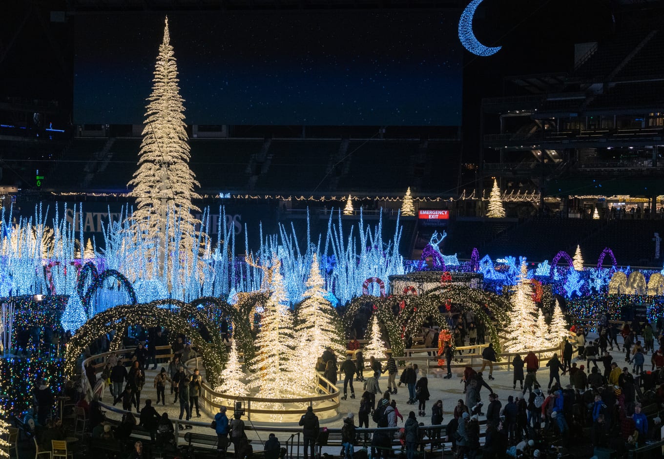 People ice skating in the Enchant Christmas Event at Safeco field, in Seattle.