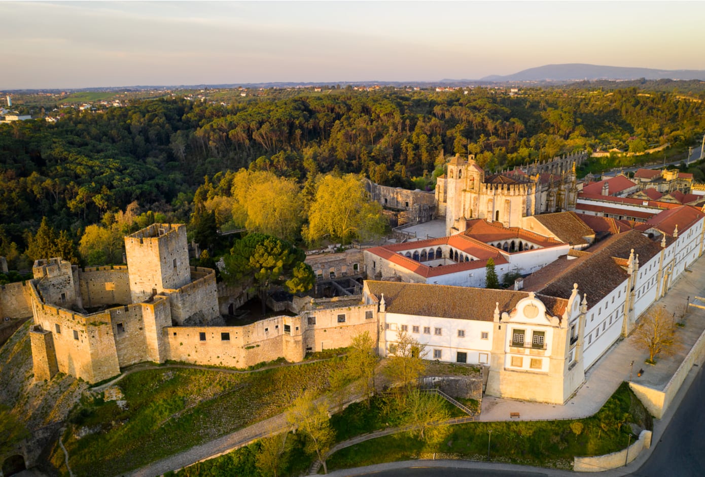 Aerial drone view of Convent of Christ in Tomar at sunrise, Portugal
