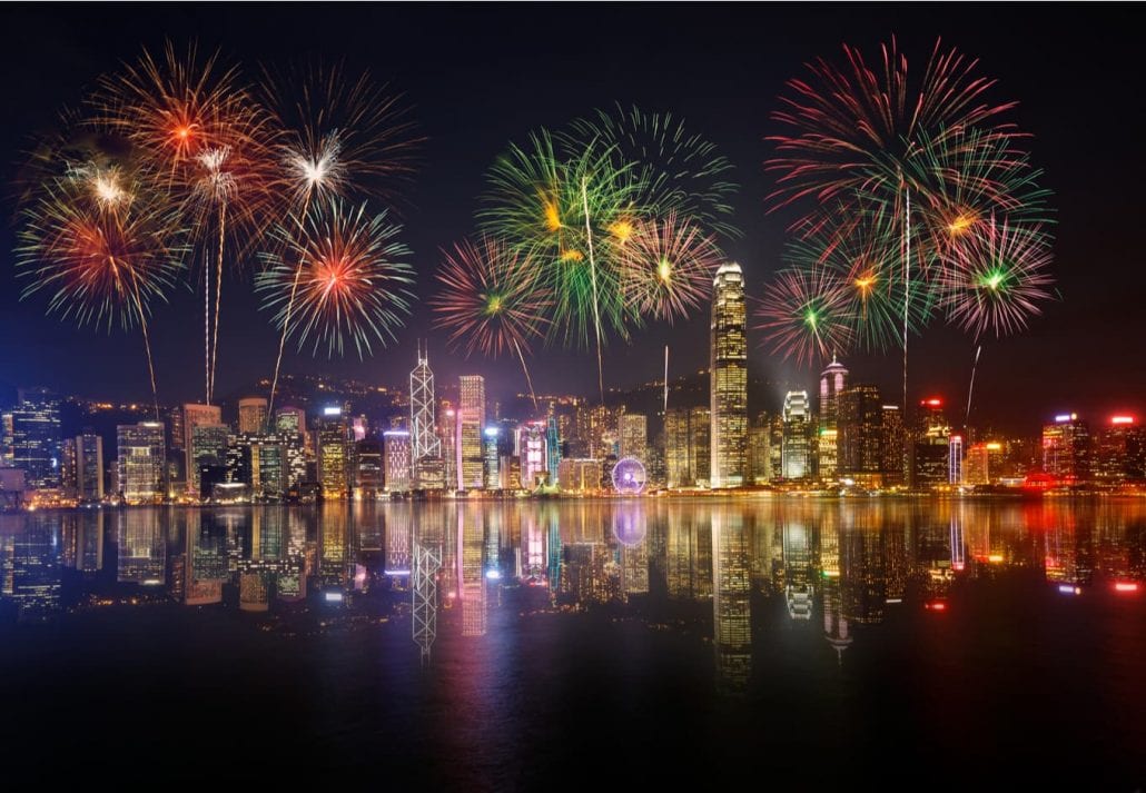 hong-kong-fireworks-new-year-destinations | CuddlyNest Travel Blog Night view and fireworks in Victoria Harbour, Hong Kong.