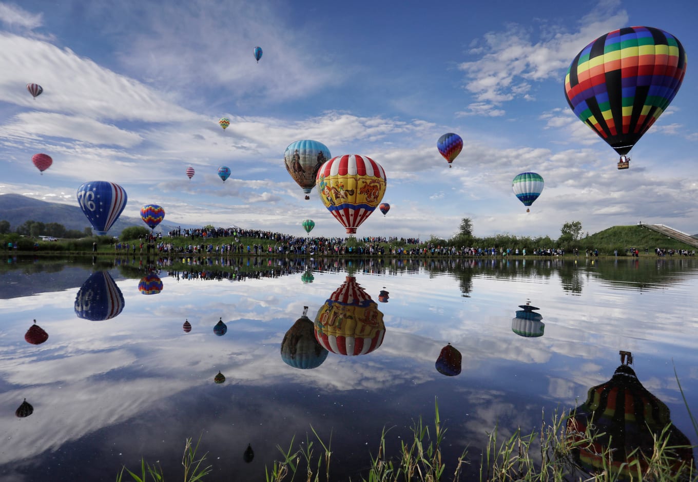 Balloons floatinh over Bald Eagle Lake, in Steamboat Springs Colorado.