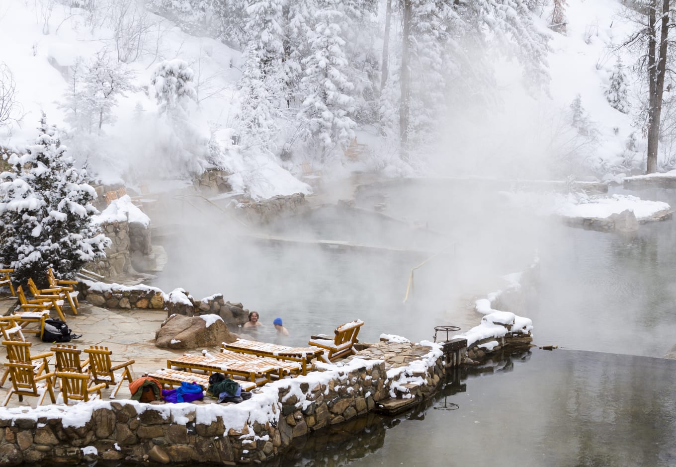 Strawberry Hot Springs, in Steamboat Springs, surrounded by a winter forest.
