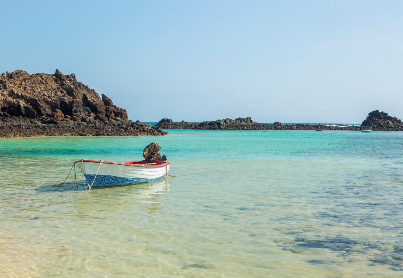 A boat on the blue-green ocean of Lobos Island, Canary Islands.