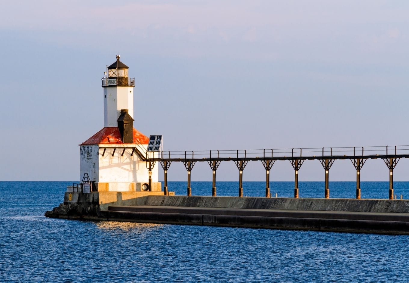 The Michigan City Lighthouse over the ocean.