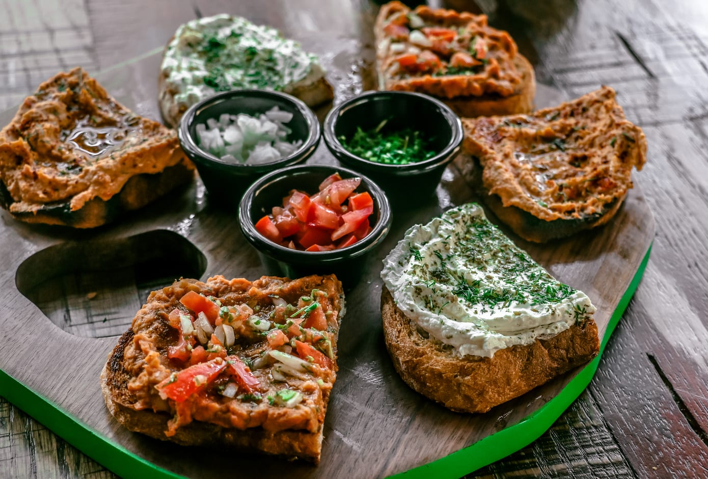 Variety of Middle Eastern sandwiches with spreads.