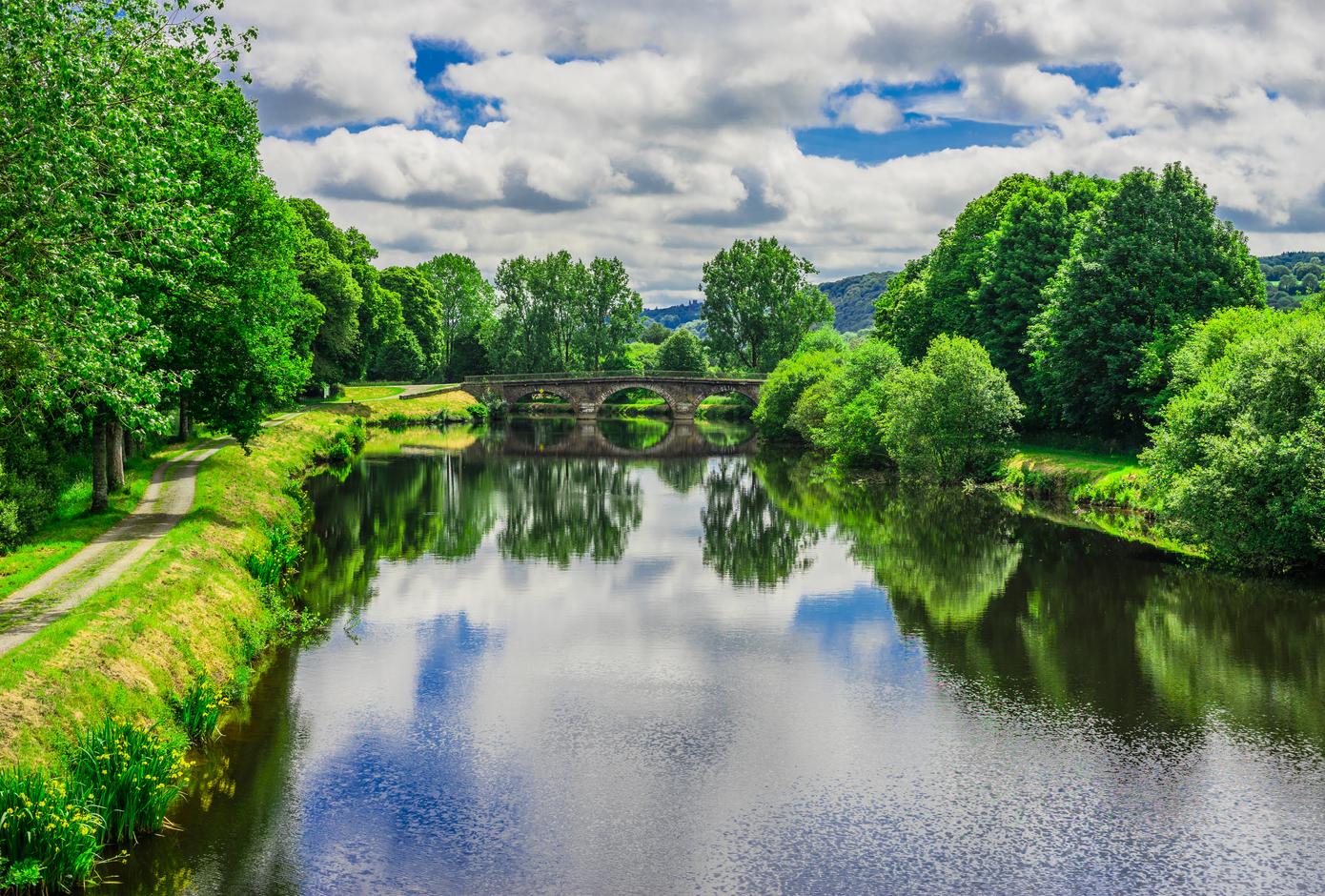 The Nantes-Brest canal surrounded by trees, in France.