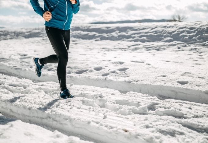 A person running in the snow.