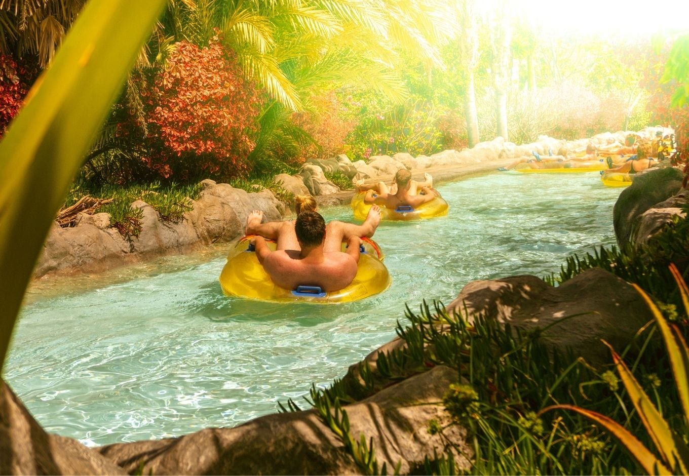 Two people on the lazy river at the Siam Park, Tenerife, Spain.