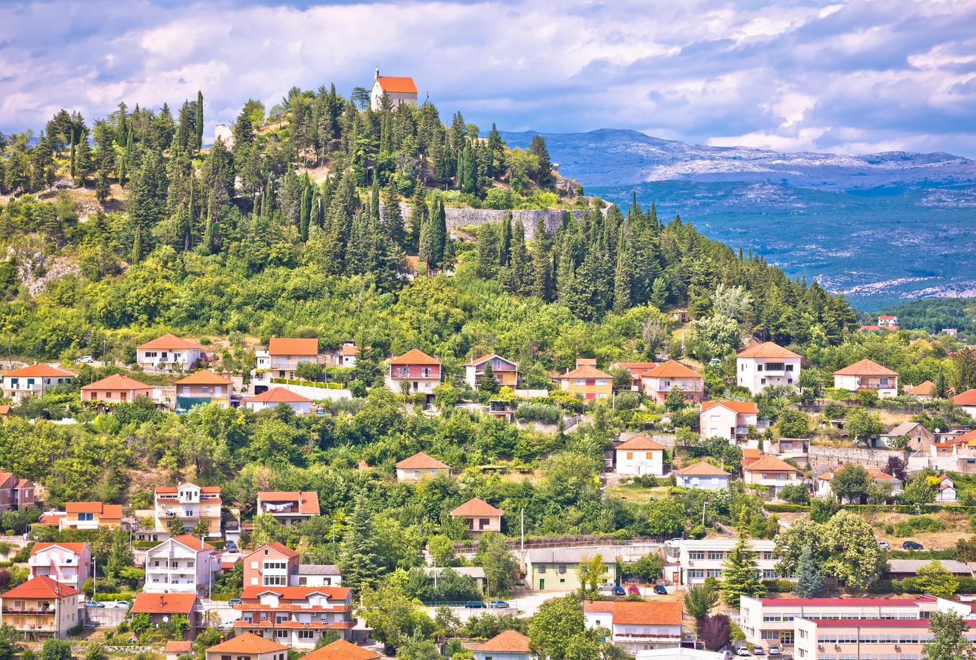 Aerial view of Sinj surounded by the Dalmatian hinterland, in Croatia.