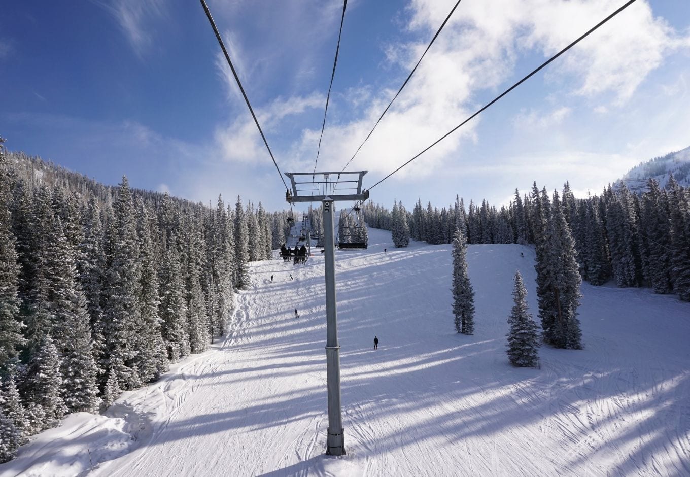 Ski lifts in the snowy mountains of Aspen Snowmass, Colorado.