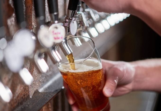 Craft beer being pulled from the tap.