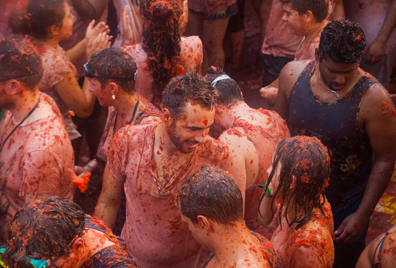 People covered in tomato juice during La Tomatina, in Spain