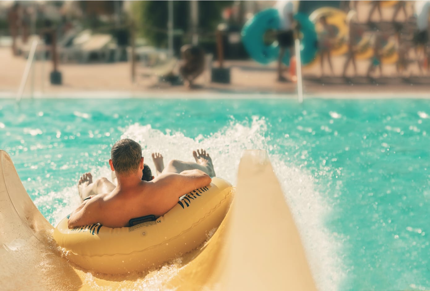 Two boys at a water slide.