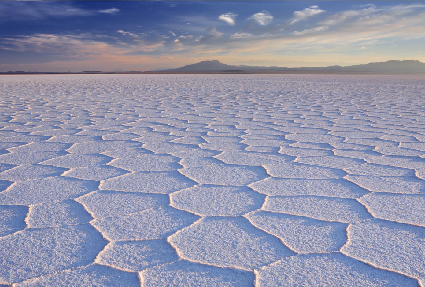 Salar de Uyuni in Altiplano, Bolivia, at dusk.