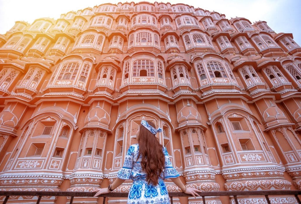 Young woman during sunset at Hawa Mahal, Jaipur, Rajasthan, India
