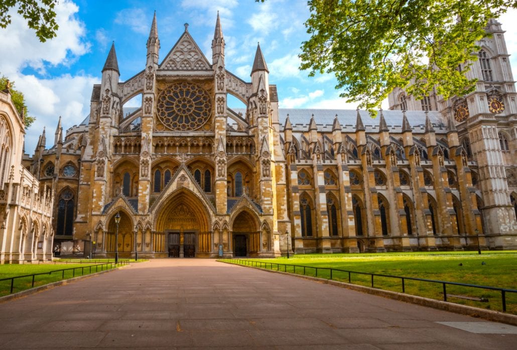 The Wesminster Abbey backed by a blue sky during a sunny, spring day.