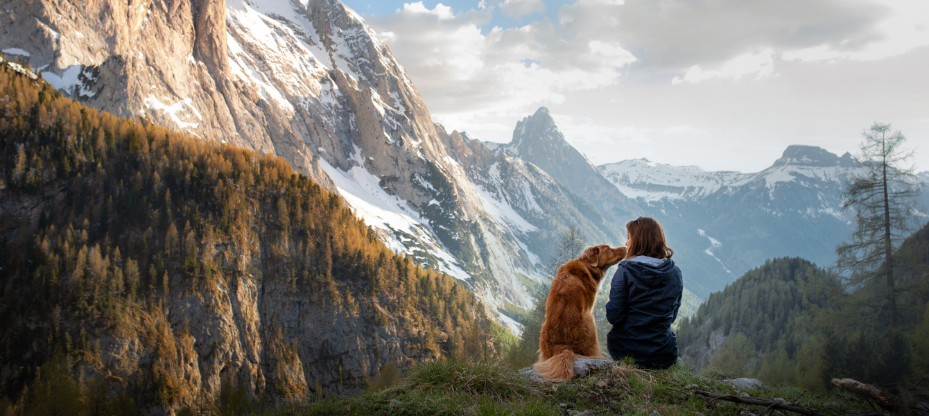 Girl with a toller dog in the mountains of Nova Scotia.