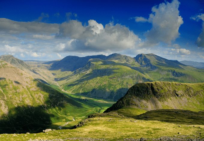 English Lake District mountains in summer. The view from Red Pike over the Mosedale Valley towards Yewbarrow, Great Gable, Kirk Fell, and the Scafell Range