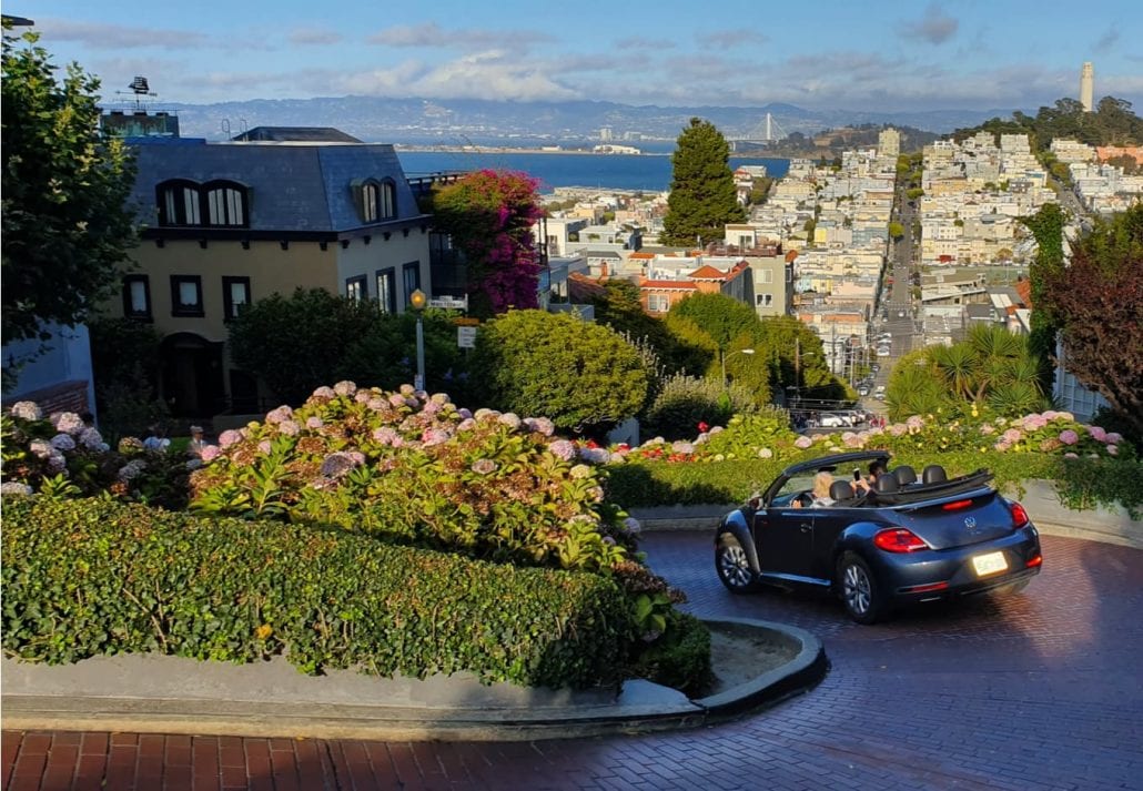 Lombard street tourists driving down the hill in San Francisco, California, USA 