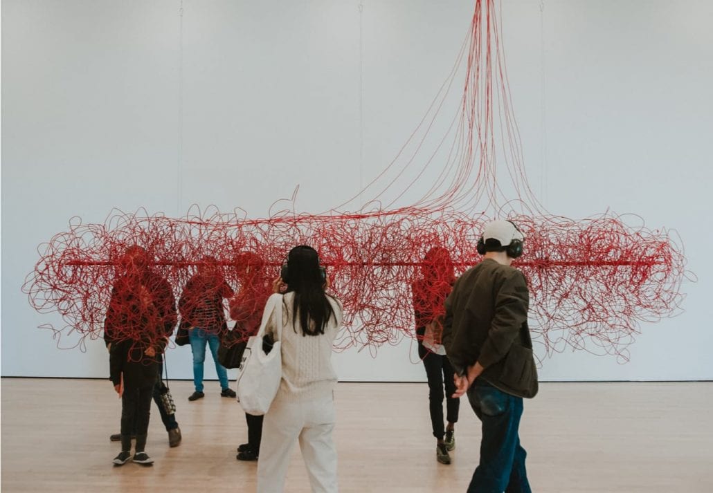 People at an art exhibition at SF MOMA.