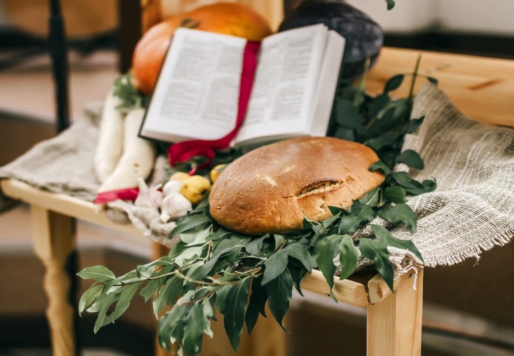 Fruits and vegetables for harvest in the church with Bible