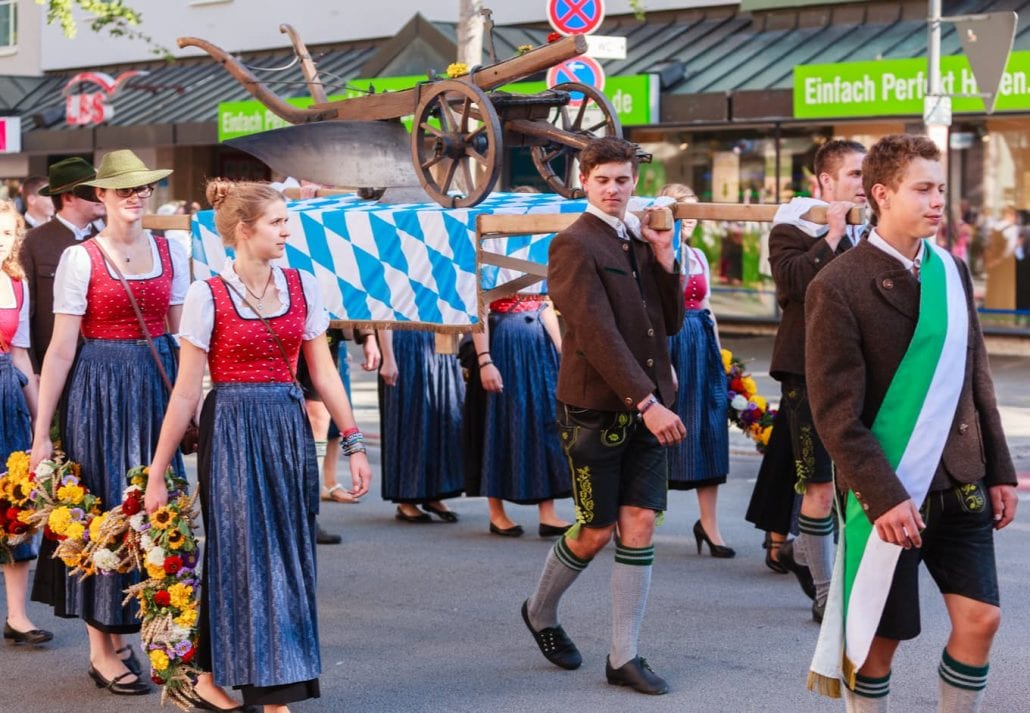 Old plow young farmers at Thanksgiving Parade in Rosenheim, Germany