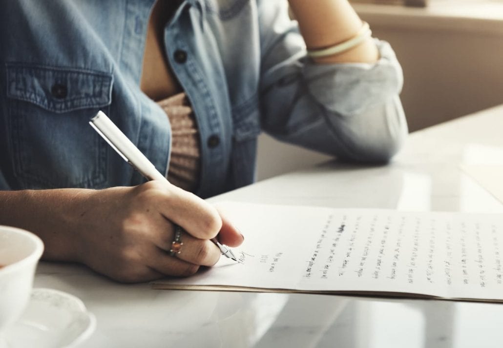 Woman writing love letter.