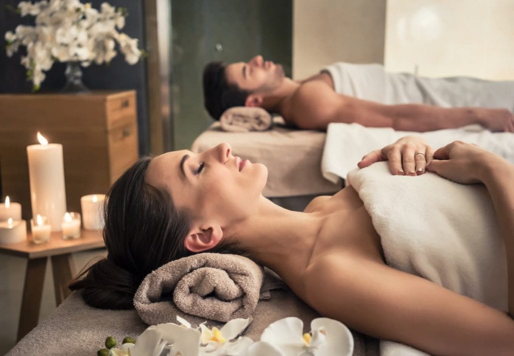 Couple getting a massage on a spa.