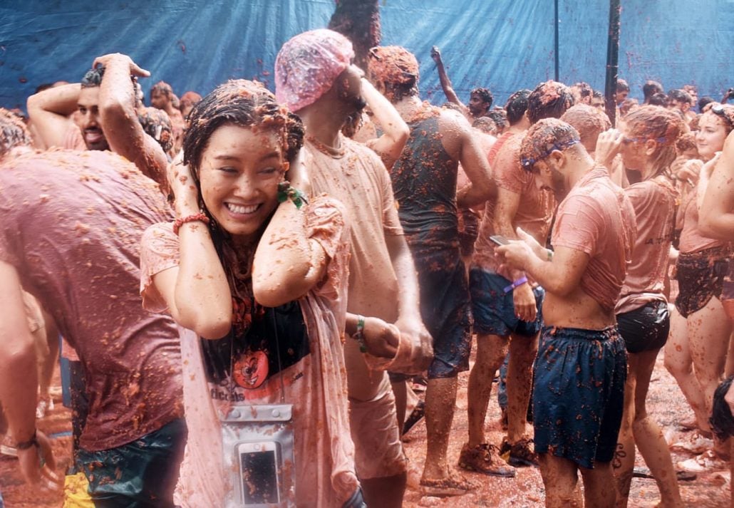 A woman in a battle of Tomatoes in La Tomatina Festival, Bunol, Spain