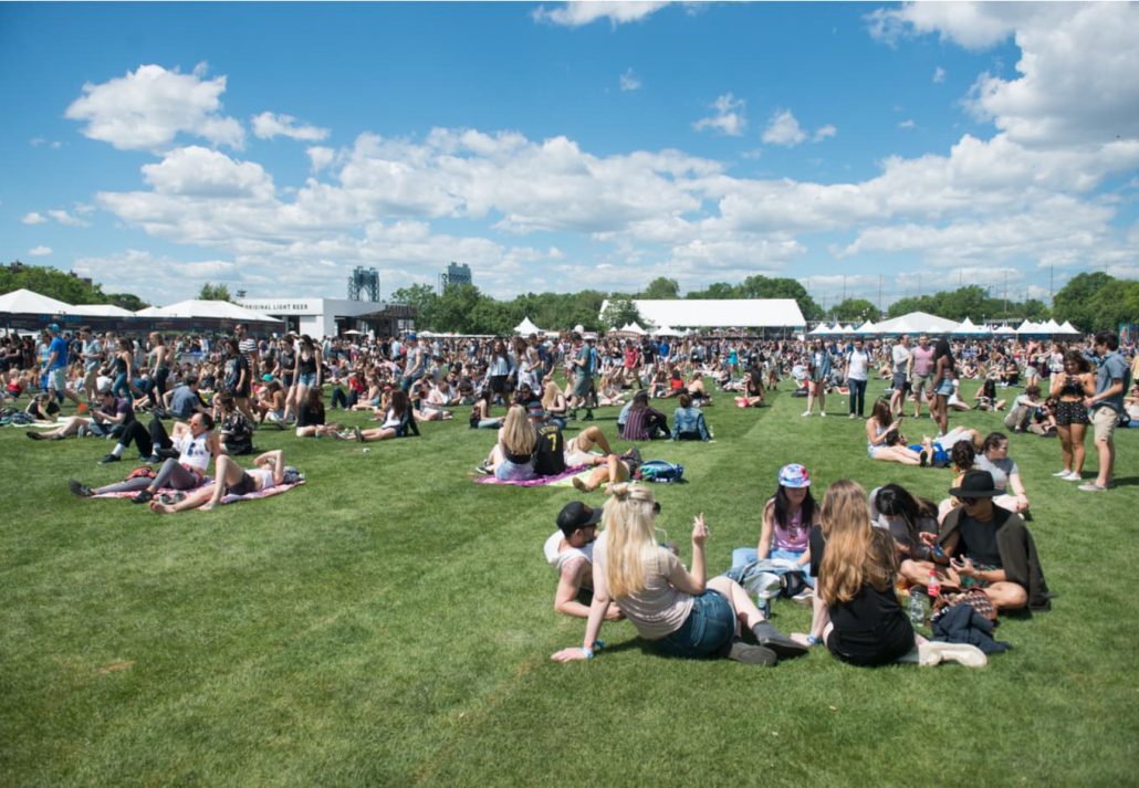 People having fun at Governors Ball Music festival at Randall's Island in New York City at summer