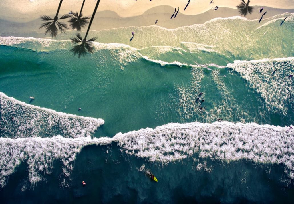 best-beaches-near-orlando-new-smyrna-florida | CuddlyNest Travel Blog Top view aerial photograph of waves in New Smyrna Beach, Florida