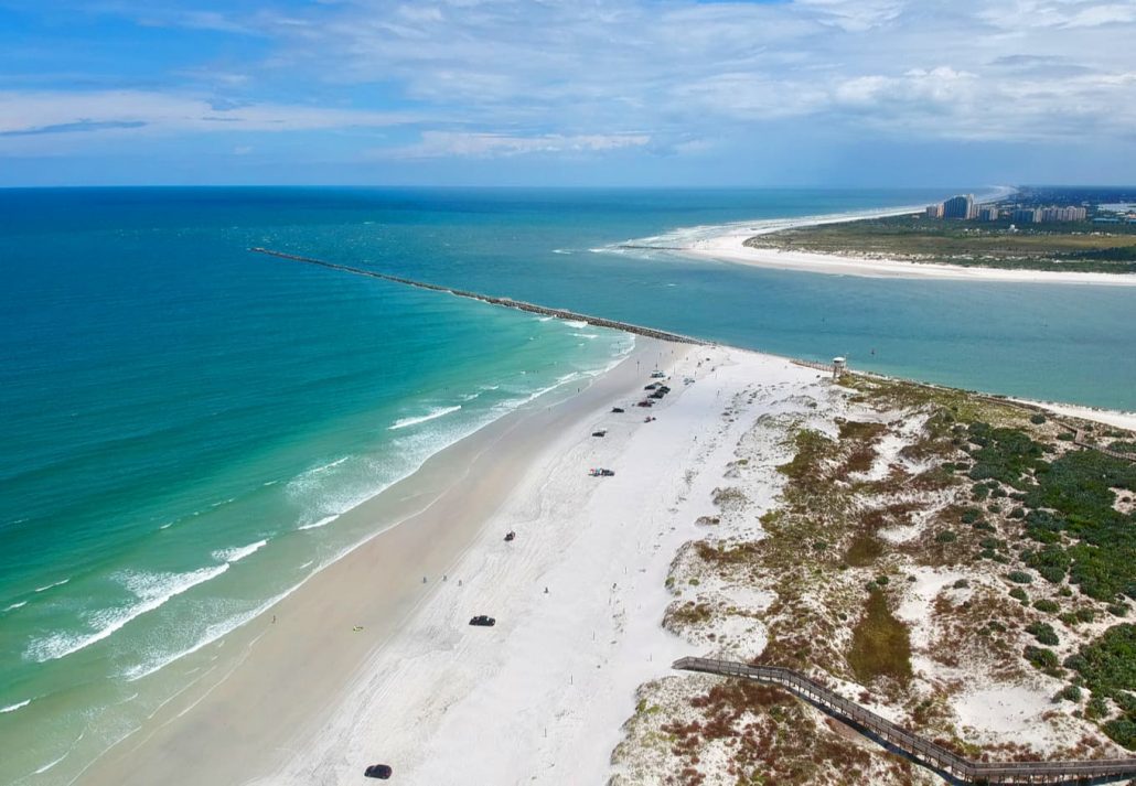 best-beaches-near-orlando-ponce-inlet-florida | CuddlyNest Travel Blog Ponce Inlet: Beautiful aerial view of the oceanic bay at Ponce Inlet, Florida..
