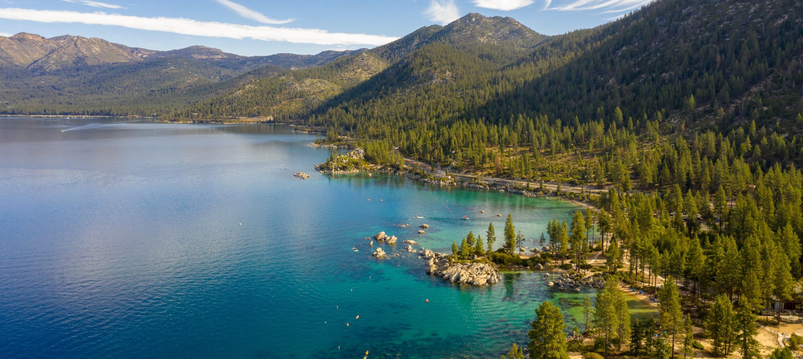 Aerial View of Lake Tahoe Shoreline with Mountains and Turquoise Blue Waters