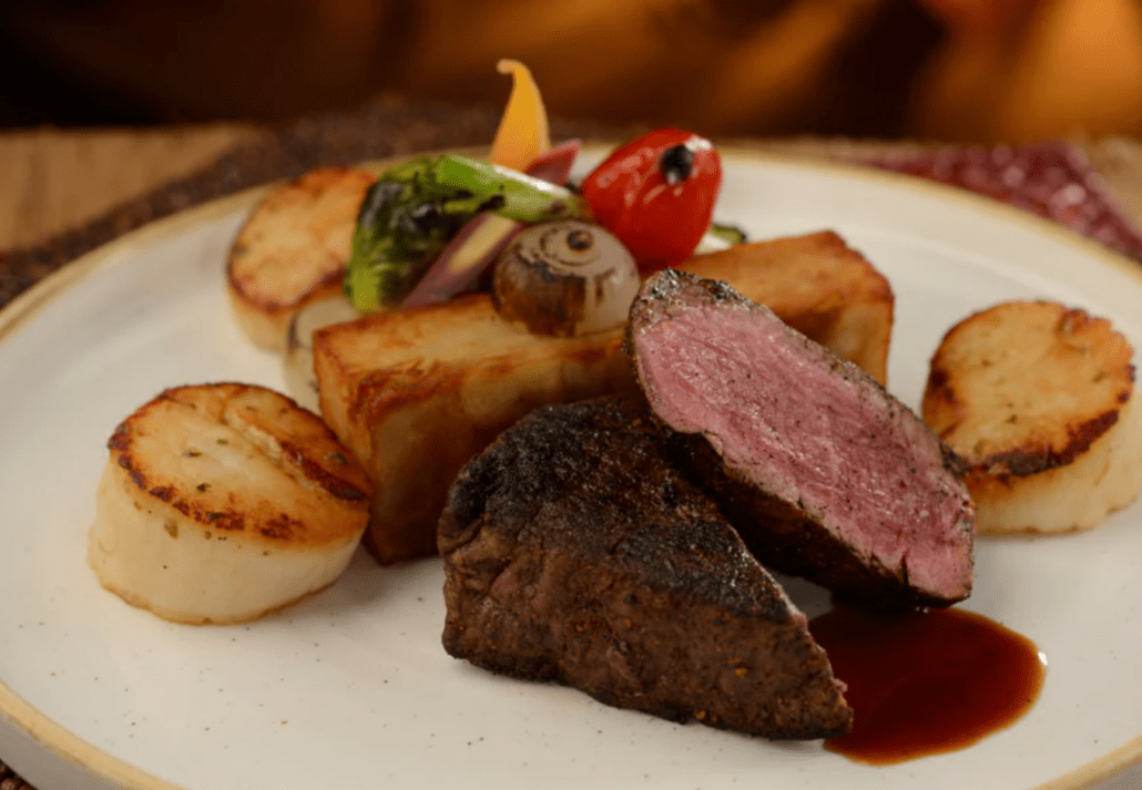 A juicy and tender steak with vegetables served at Tiffin, Orlando.