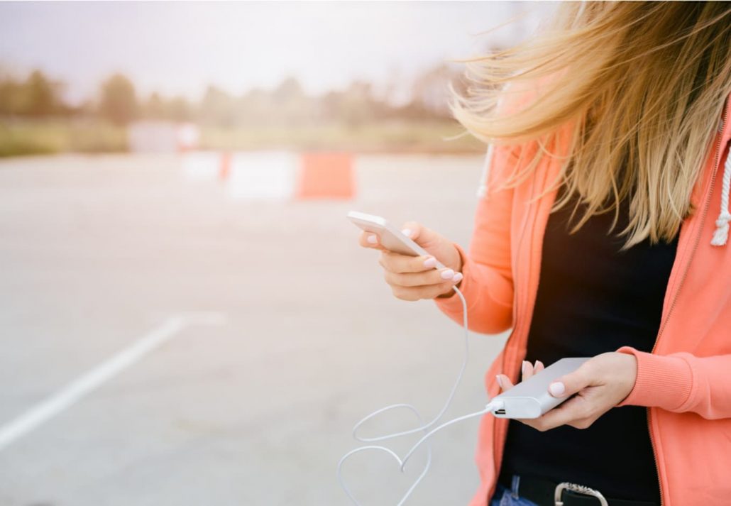 Woman charging phone on powerbank