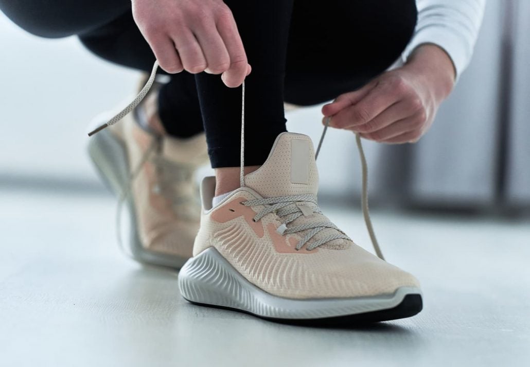 Woman tying shoelaces